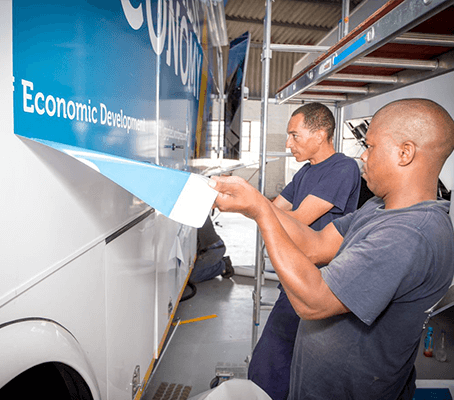 Branding being applied onto a bus